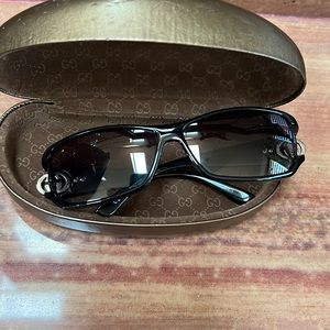 Gucci black sunglasses with stones.